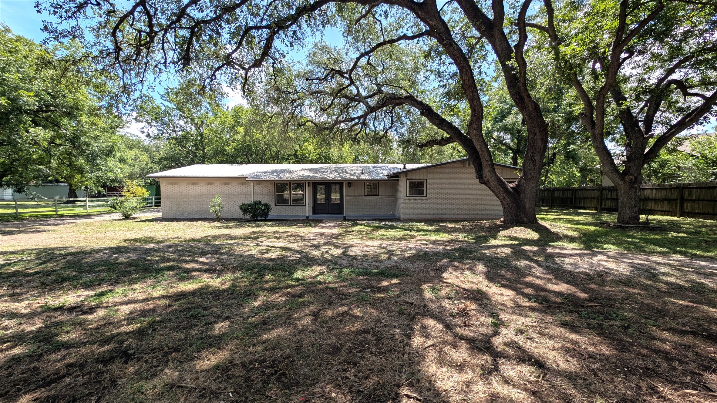 11811 Sleepy Hollow Road Manchaca, TX 78652 - Photo 2 of 31 a view of a house with a yard and tree