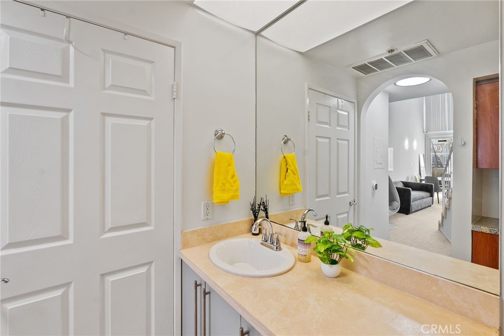 620 South Gramercy Place, Unit 412 Los Angeles, CA 90010 - Photo 18 of 41 a bathroom with a sink and a mirror