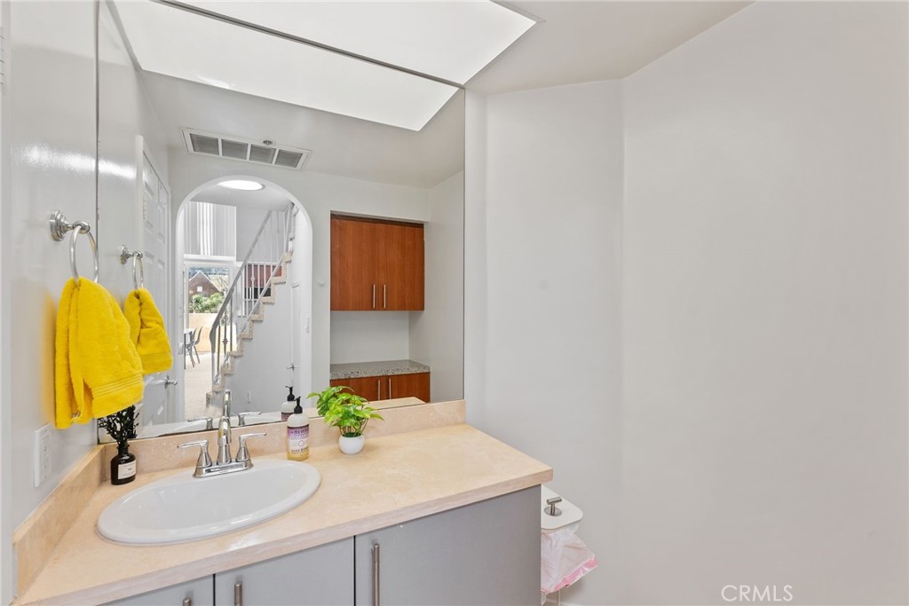 620 South Gramercy Place, Unit 412 Los Angeles, CA 90010 - Photo 19 of 41 a bathroom with a sink and a mirror