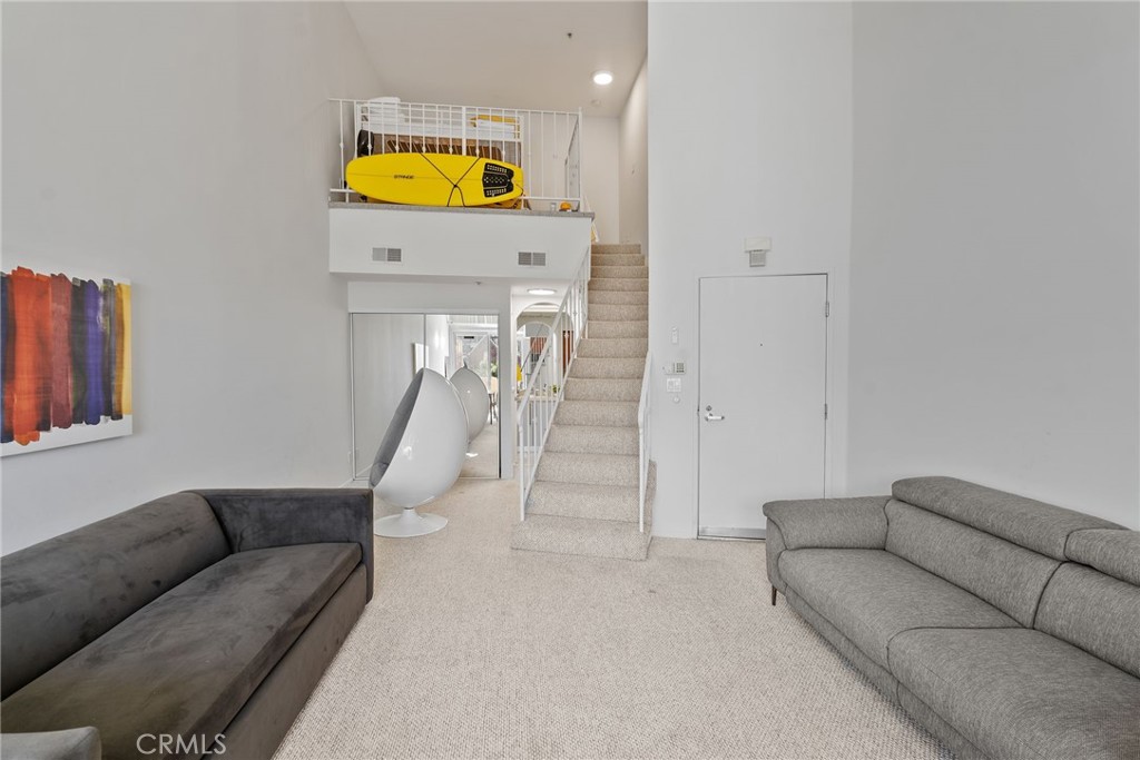 620 South Gramercy Place, Unit 412 Los Angeles, CA 90010 - Photo 2 of 41 a living room with furniture and a wooden floor