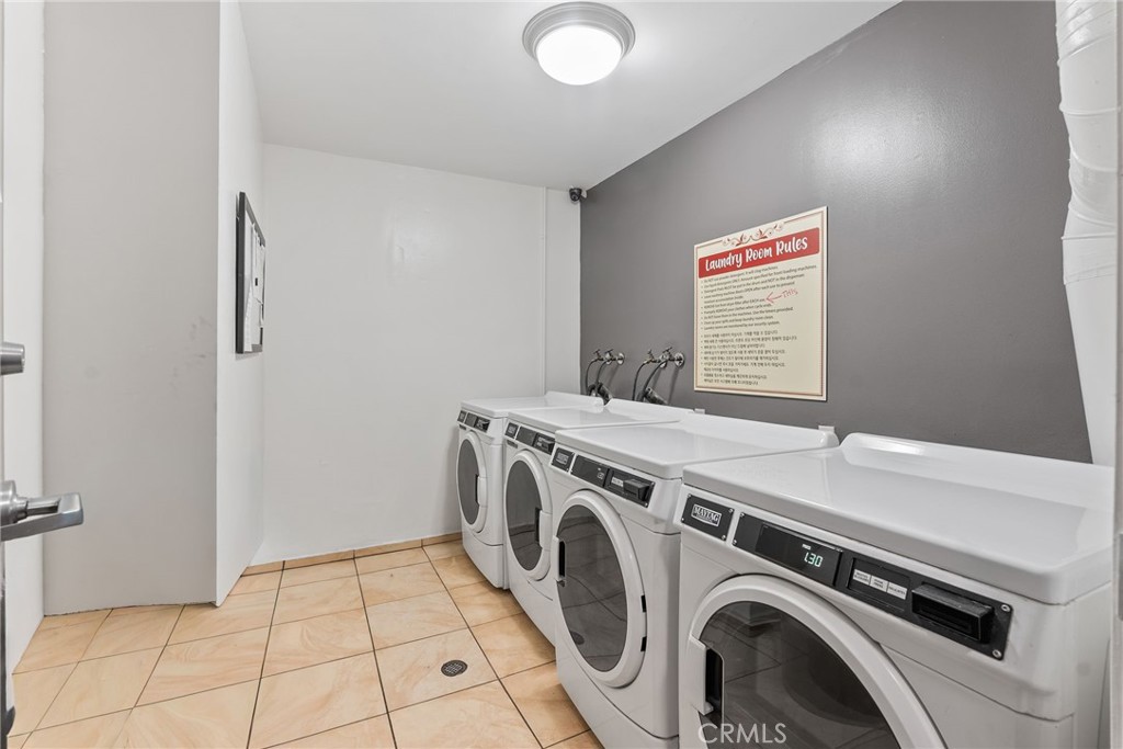 620 South Gramercy Place, Unit 412 Los Angeles, CA 90010 - Photo 22 of 41 a utility room with dryer and washer