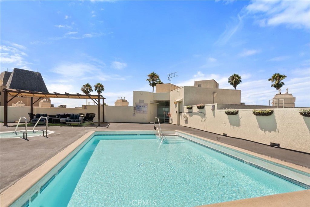 620 South Gramercy Place, Unit 412 Los Angeles, CA 90010 - Photo 26 of 41 a view of a swimming pool with a patio