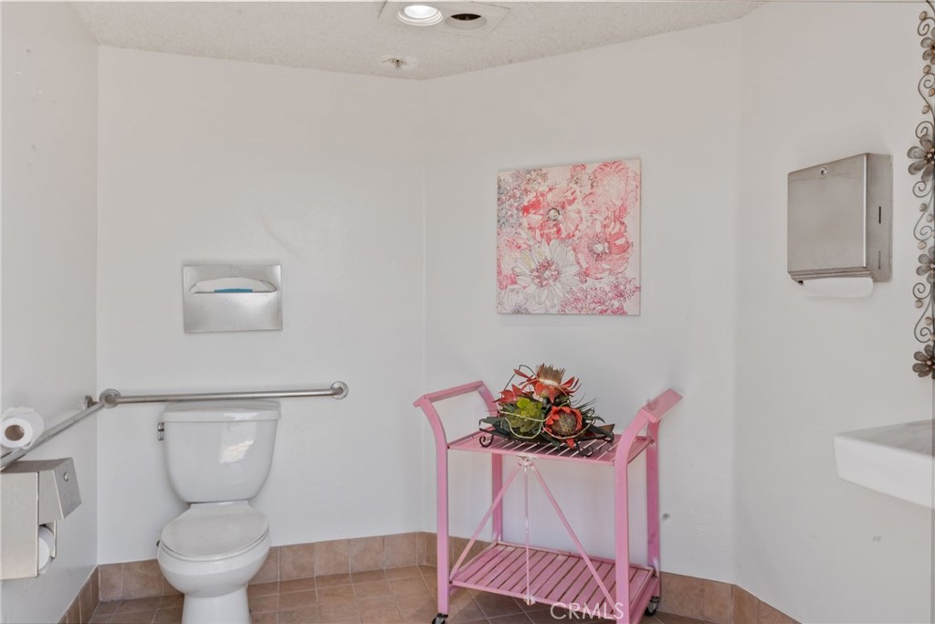 620 South Gramercy Place, Unit 412 Los Angeles, CA 90010 - Photo 29 of 41 a bath room with a toilet and a potted plant