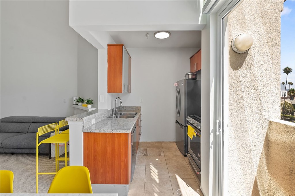 620 South Gramercy Place, Unit 412 Los Angeles, CA 90010 - Photo 7 of 41 a bathroom with a sink and a mirror