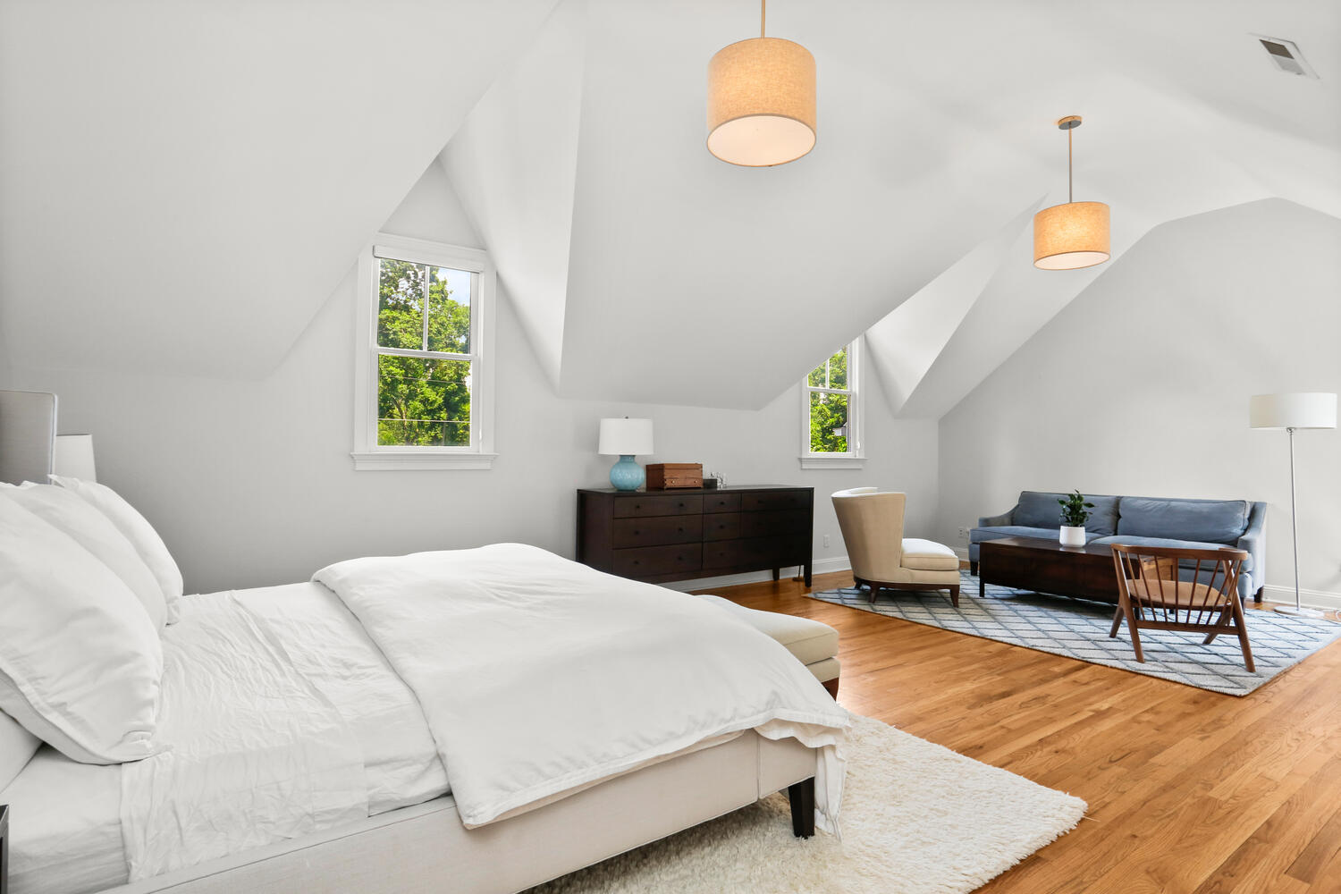 12 Ridgewood Road Rowayton, CT 06853 - Photo 20 of 35 a bedroom with a bed a table and a window