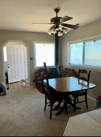 a view of a dining room with furniture