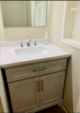 a bathroom with a sink and a mirror