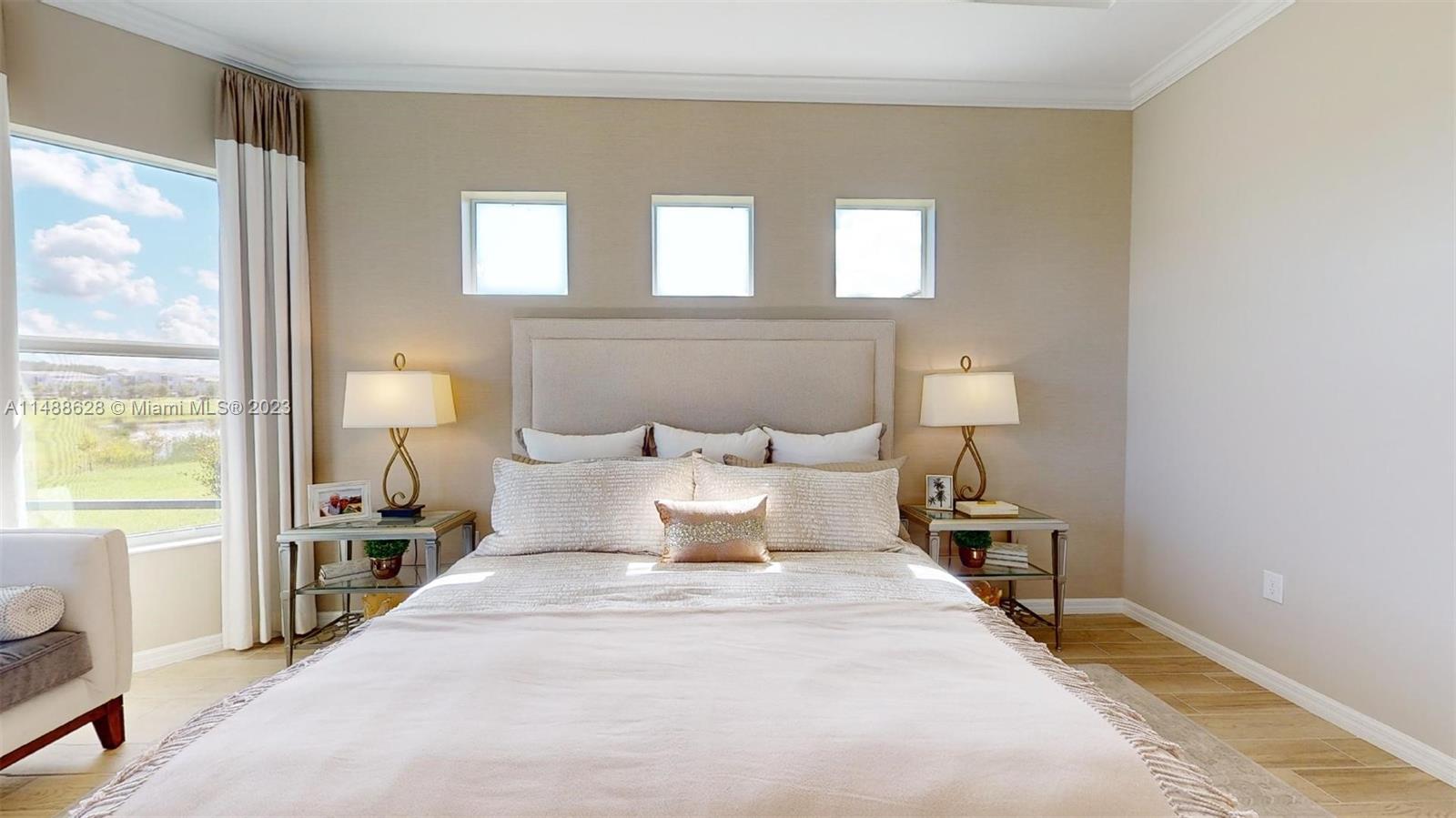 Ave Maria Immokalee, FL 34142 - Photo 22 of 64 a large bed sitting in a bedroom next to a window