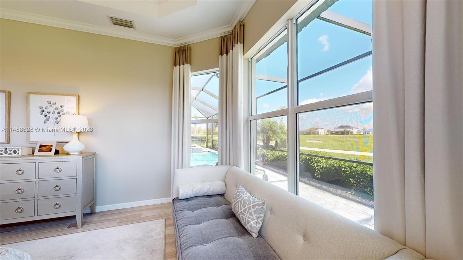 Ave Maria Immokalee, FL 34142 - Photo 25 of 64 a living room with furniture and a window