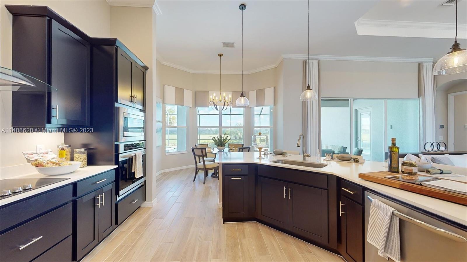 Ave Maria Immokalee, FL 34142 - Photo 4 of 64 a open kitchen with lots of counter space a sink and appliances