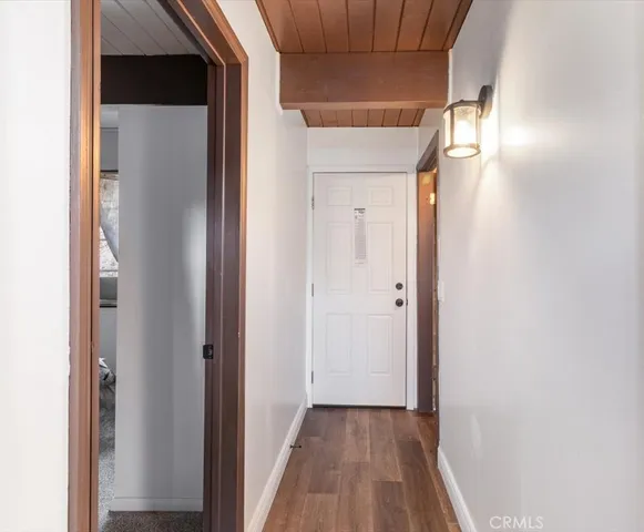 a kitchen with a refrigerator and a stove top oven