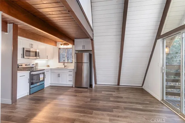 a view of roof deck with wooden floor and outer view