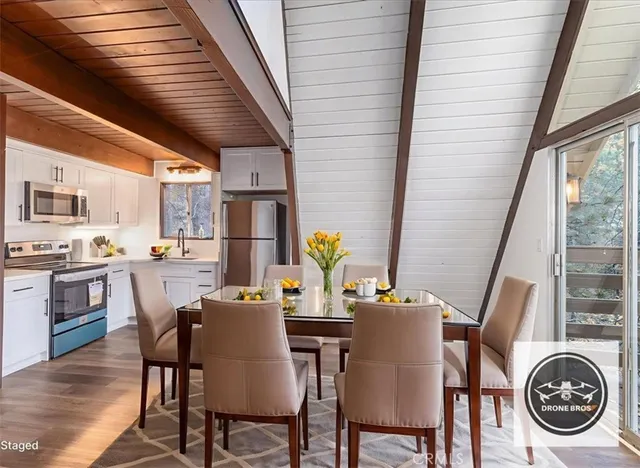 a view of a room with wooden floor and door