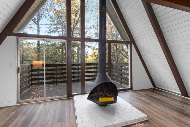 a bedroom with a bed and flowerpot