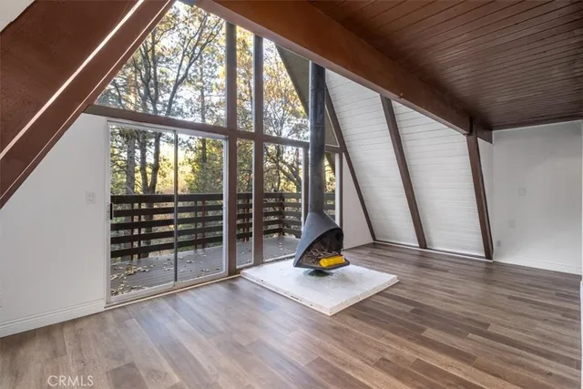 a bedroom with a bed and a night stand