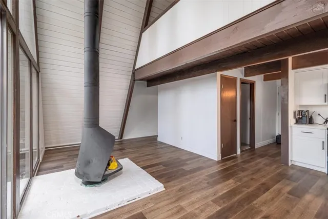 a view of outdoor space with deck and wooden fence
