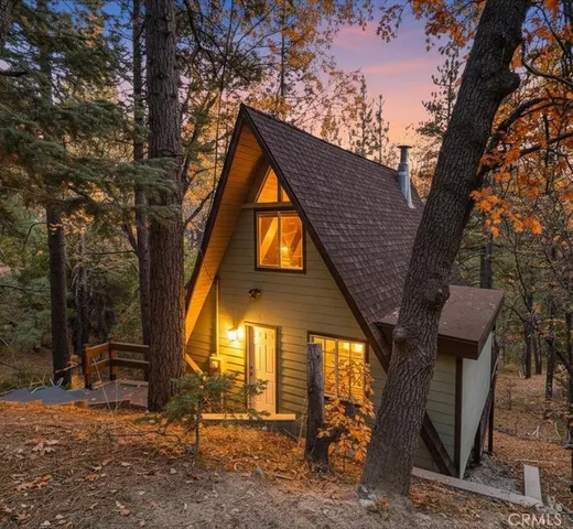 a view of a house with a snow in the background