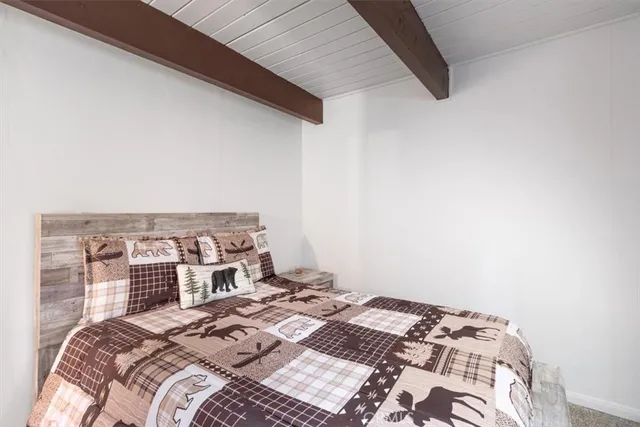 a living room with furniture a rug and a window