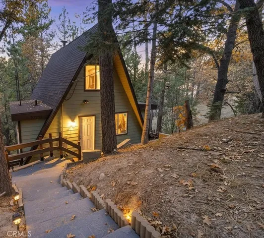 a view of a house with a snow in the background