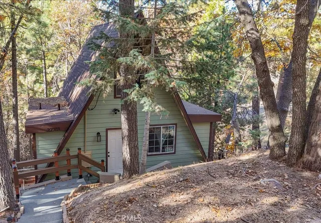a view of entryway with wooden floor and staircase
