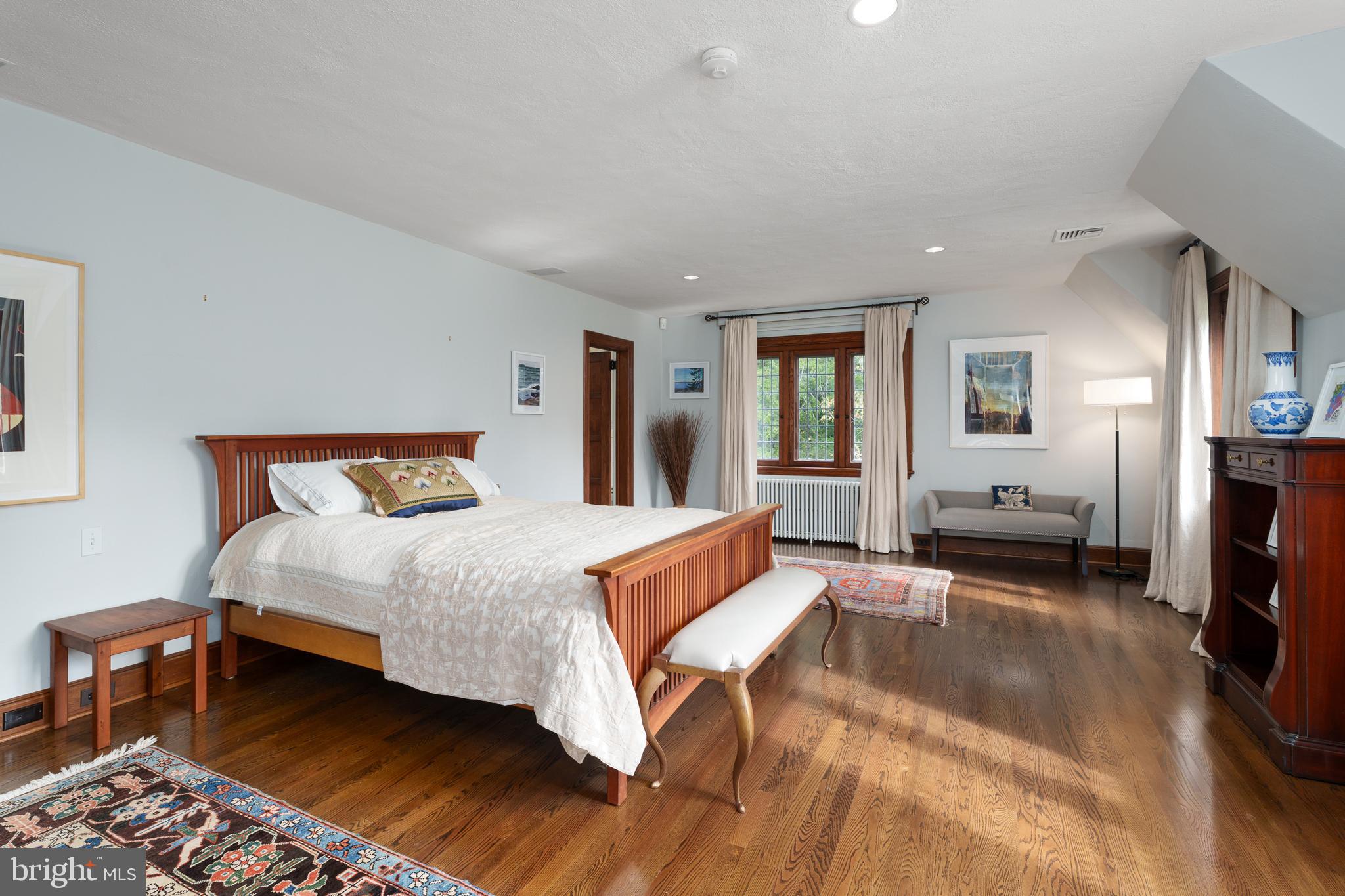 94 N Road Princeton, NJ 08540 - Photo 26 of 57 a large bedroom with a bed and wooden floor