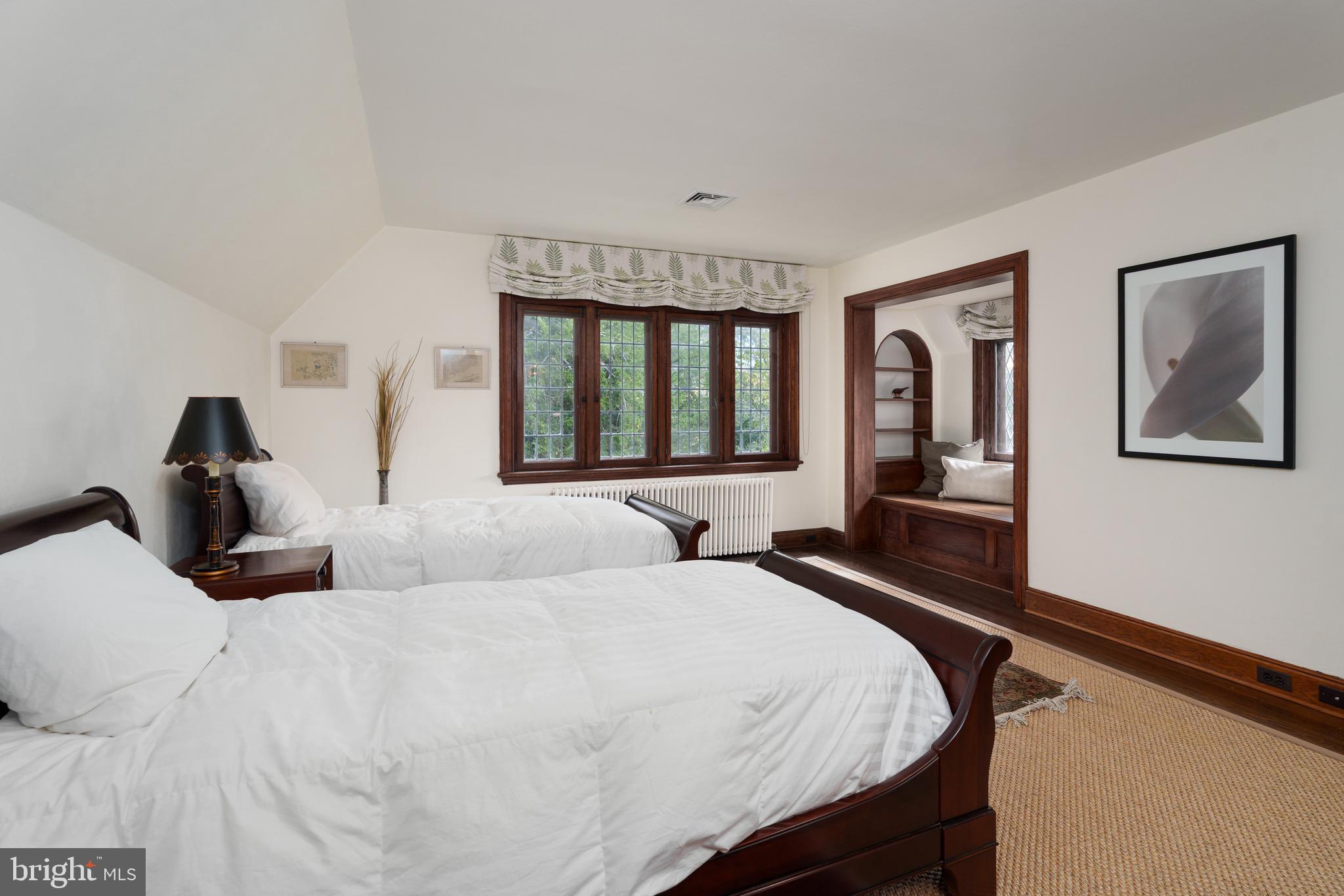 94 N Road Princeton, NJ 08540 - Photo 33 of 57 a bedroom with a large bed and a chandelier