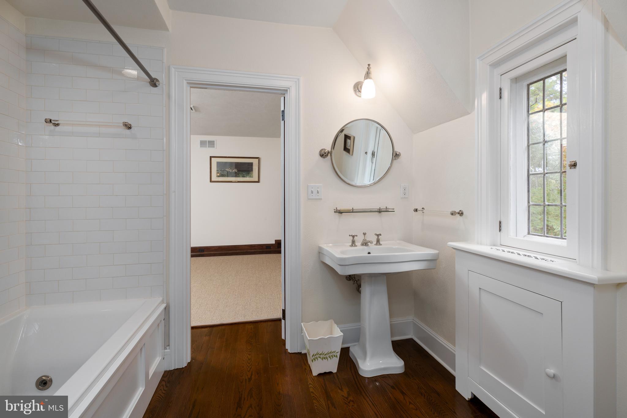 94 N Road Princeton, NJ 08540 - Photo 35 of 57 a bathroom with a sink a mirror and a bathtub