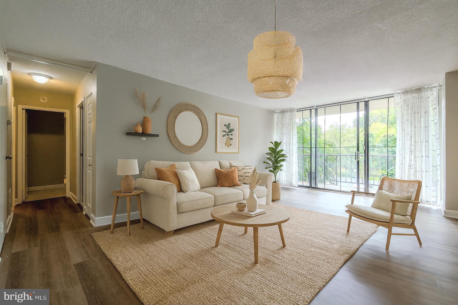 801 Yale Avenue, Unit 107 Swarthmore, PA 19081 - Photo 1 of 35 a living room with furniture and a large window