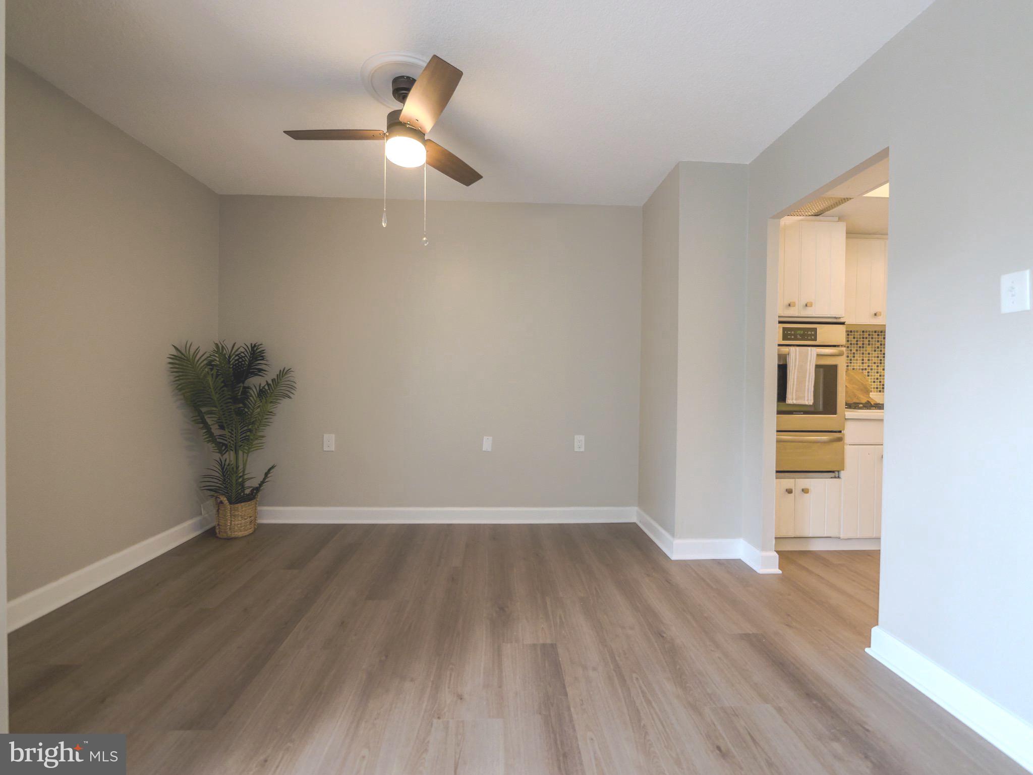 801 Yale Avenue, Unit 107 Swarthmore, PA 19081 - Photo 14 of 35 wooden floor in an empty room with a window