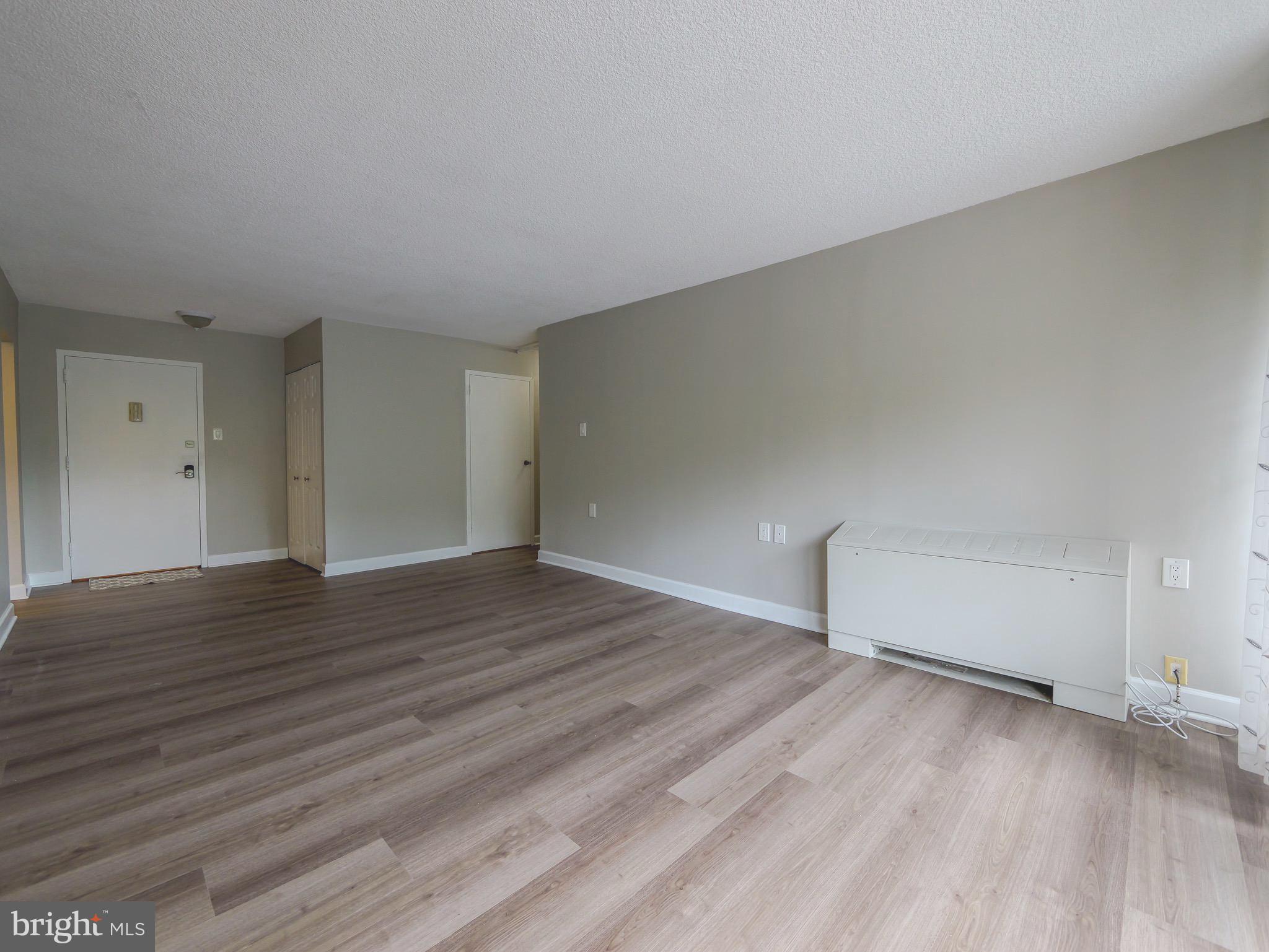 801 Yale Avenue, Unit 107 Swarthmore, PA 19081 - Photo 17 of 35 a view of empty room with wooden floor