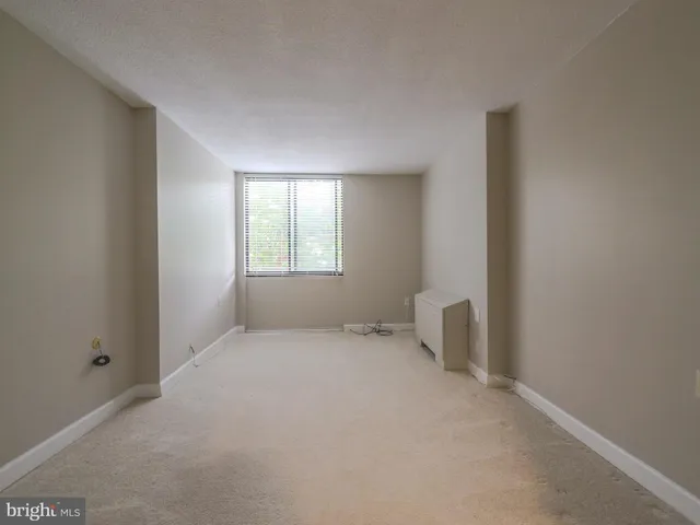 a view of an empty room and window