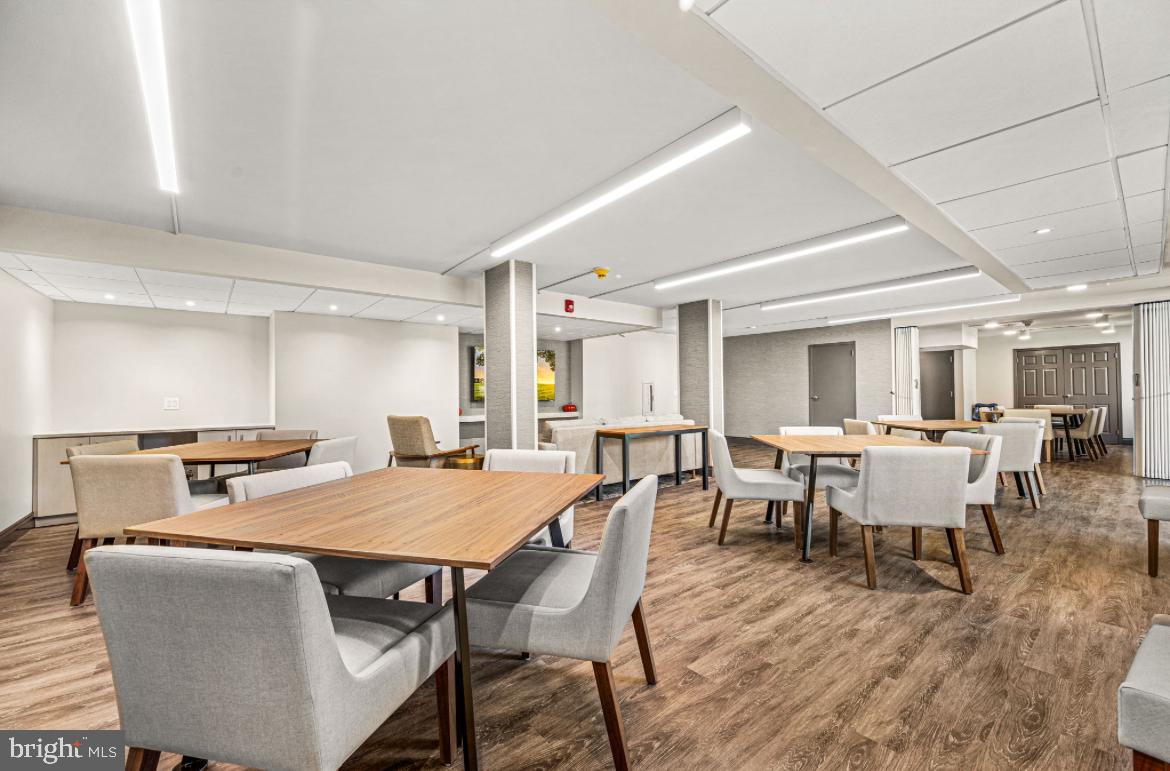 801 Yale Avenue, Unit 107 Swarthmore, PA 19081 - Photo 31 of 35 a view of a dining room with furniture and wooden floor