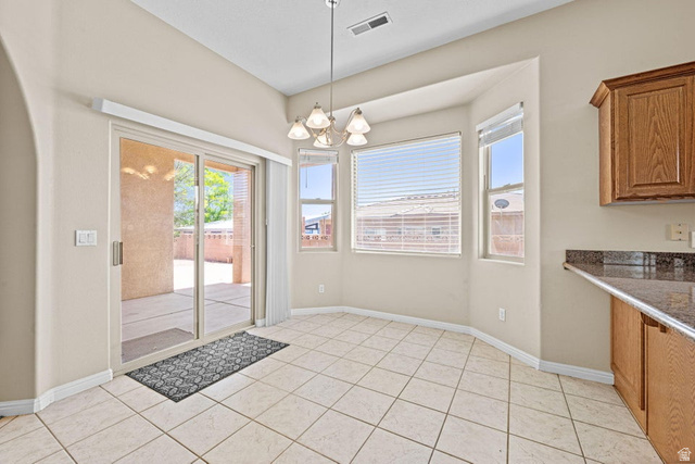 2226 East 140 South St. George, UT 84790 - Photo 7 of 20 Dining area with tile flooring and a multi-light chandelier