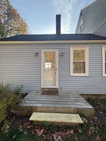 a view of a house with a backyard