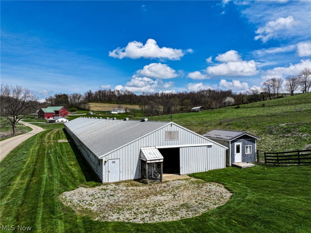 4371 Valley Road Baltic, OH 43804 - Photo 10 of 17 View of outdoor structure with a rural view and a lawn