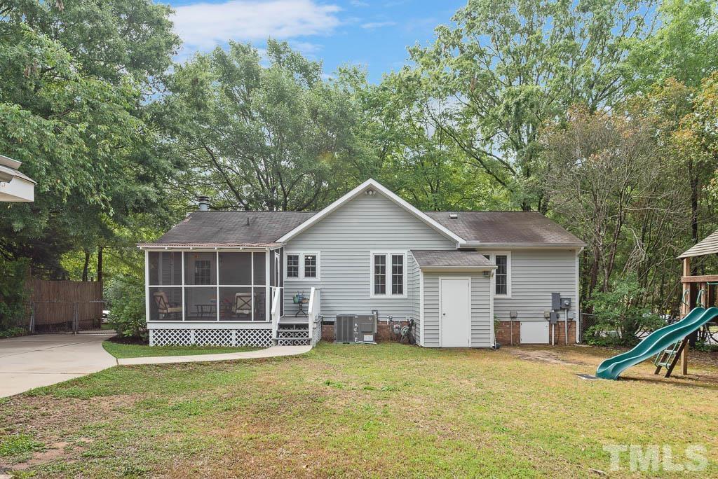 3601 Constellation Drive Raleigh, NC 27604 - Photo 7 of 30 a view of a house with a backyard and a tree