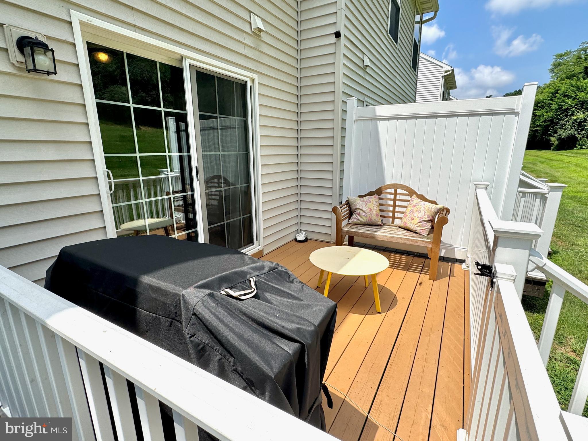 16 Chaser Court Reading, PA 19607 - Photo 30 of 31 a view of a patio with table and chairs with wooden floor and fence