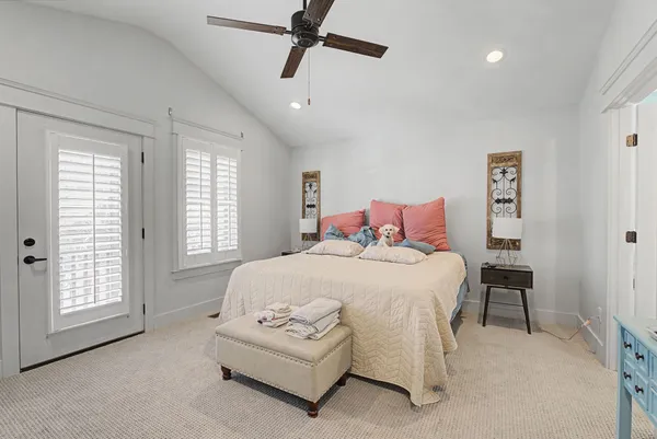 a bedroom with bed and window