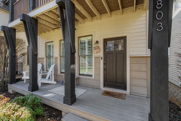 a front view of a house with a glass door