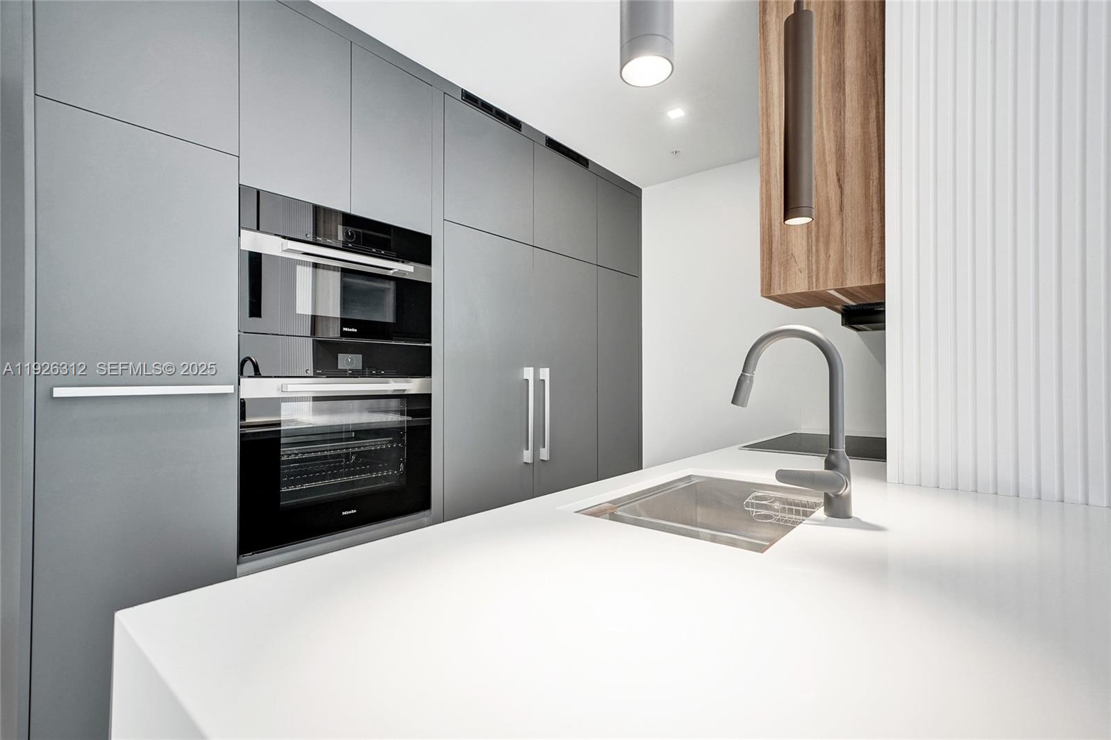 200 Sunrise Drive, Unit 200A Key Biscayne, FL 33149 - Photo 15 of 45 a bedroom with a bed and dresser