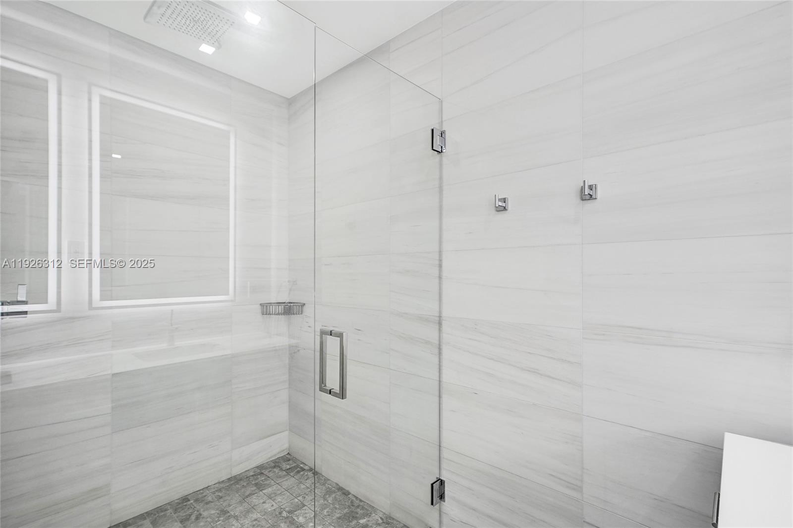 200 Sunrise Drive, Unit 200A Key Biscayne, FL 33149 - Photo 18 of 45 a bathroom with a shower