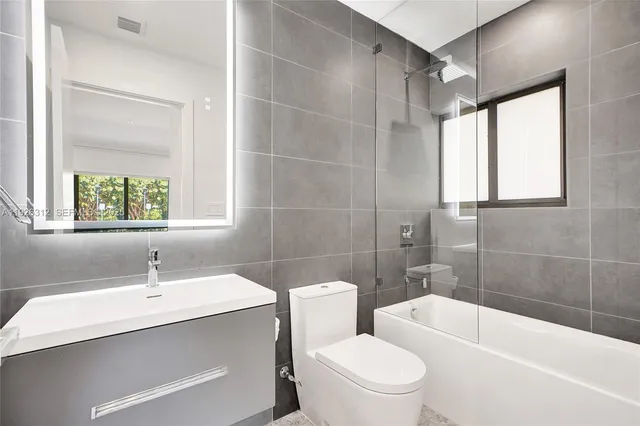 a view of hallway with wooden floor