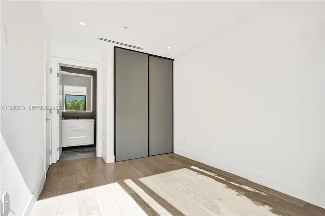 a close view of a utility room with dryer and washer