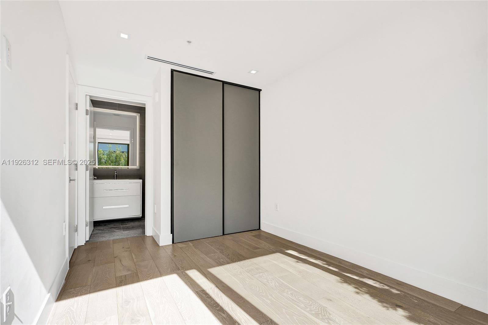 200 Sunrise Drive, Unit 200A Key Biscayne, FL 33149 - Photo 26 of 45 a view of a hallway with a bedroom