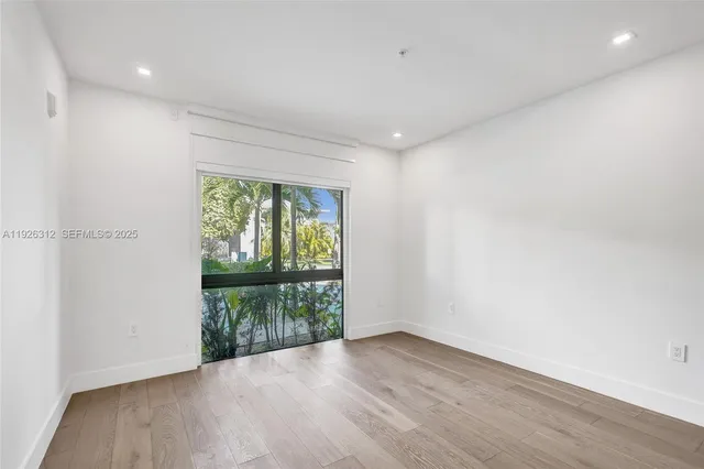 a front view of a house with outdoor seating