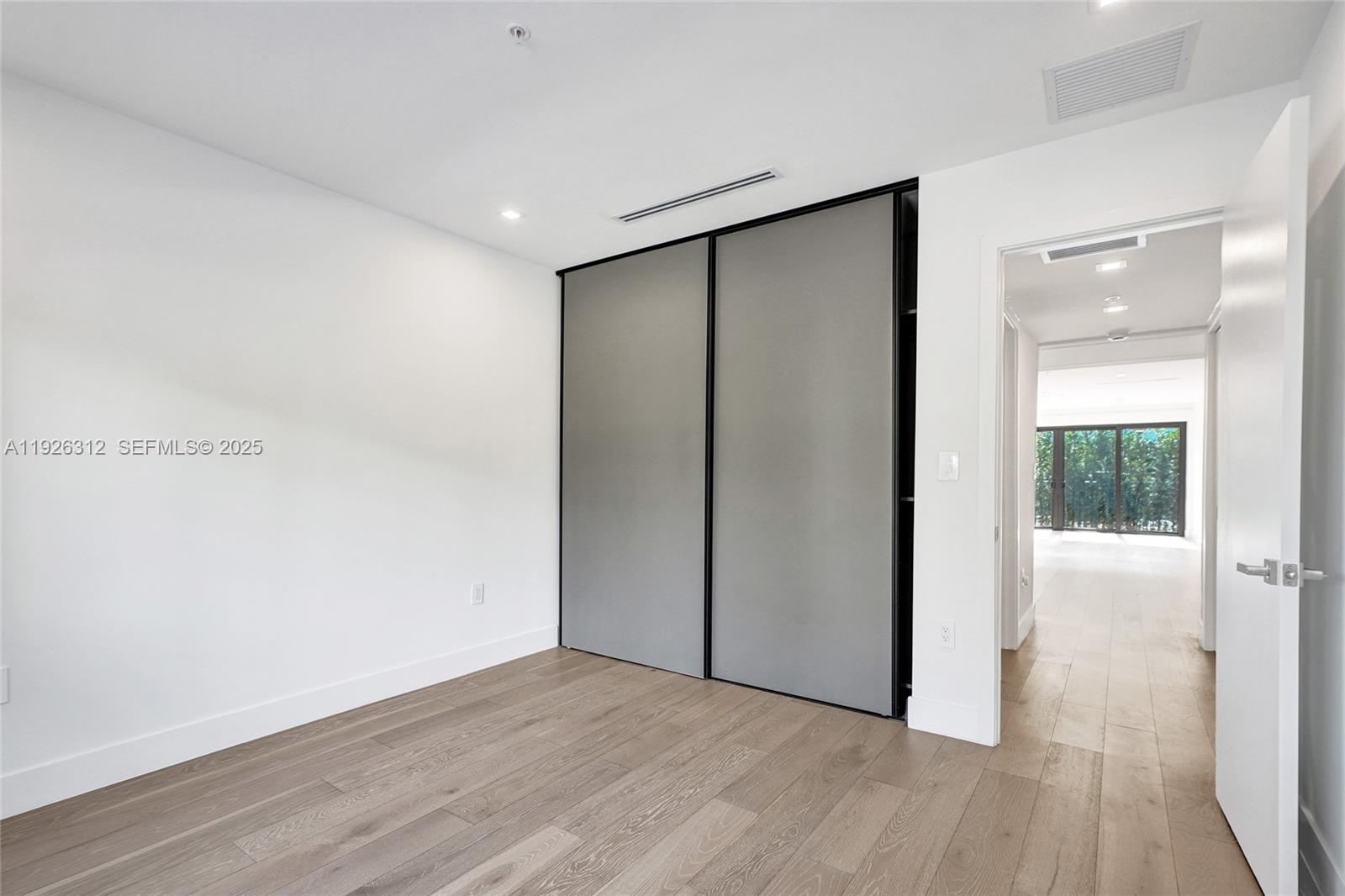 200 Sunrise Drive, Unit 200A Key Biscayne, FL 33149 - Photo 31 of 45 a view of hallway with wooden floor