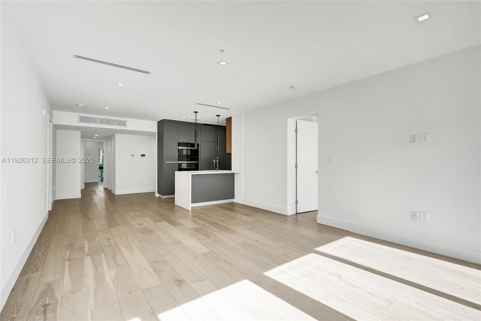 200 Sunrise Drive, Unit 200A Key Biscayne, FL 33149 - Photo 4 of 45 a view of a kitchen with a sink and a refrigerator