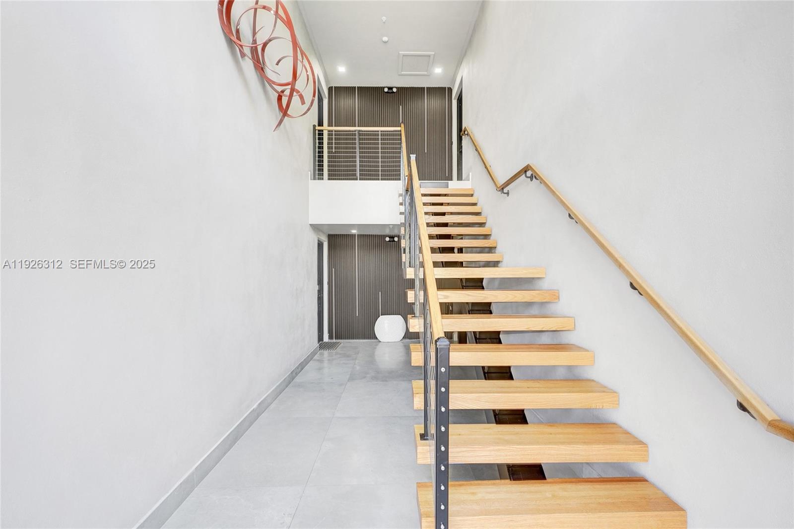 200 Sunrise Drive, Unit 200A Key Biscayne, FL 33149 - Photo 42 of 45 a view of entryway and hall with wooden floor