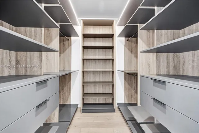 a bedroom with a bed and dresser