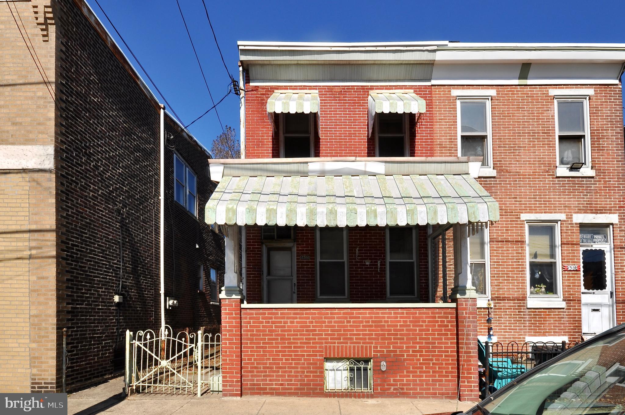 4566 Bermuda Street Philadelphia, PA 19124 - Photo 1 of 30 a view of a building with a window and brick walls